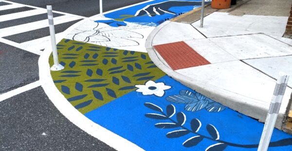 Street mural on the intersection of Adams street and E. Third street.
